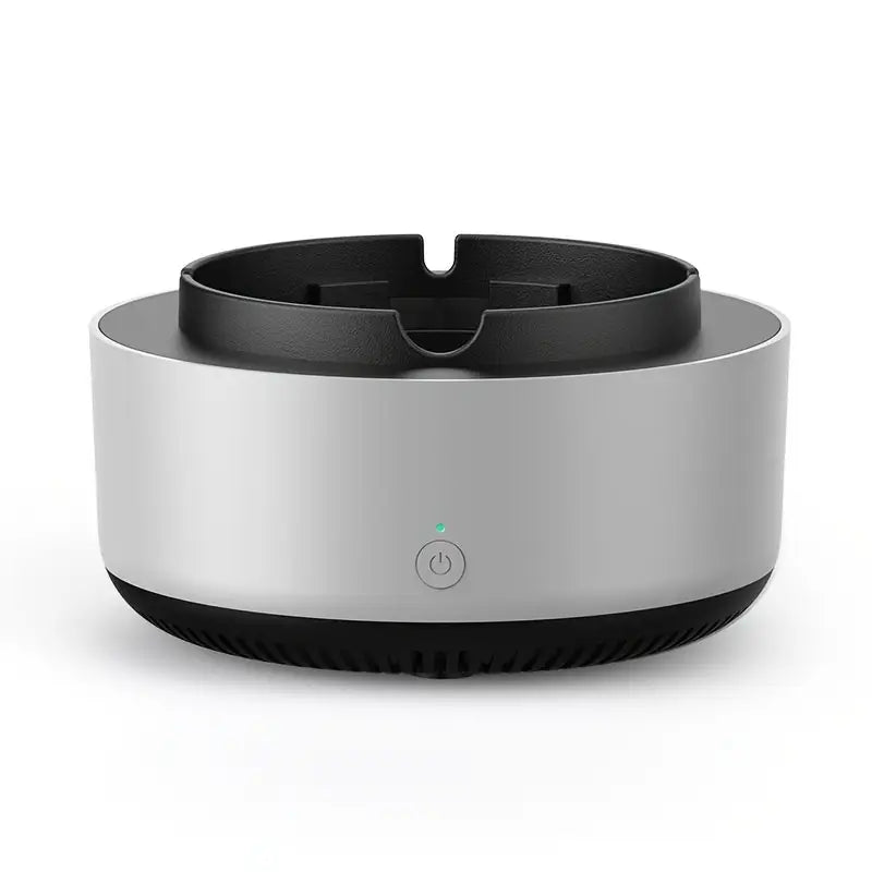 Round electronic device with black top and base on a white background