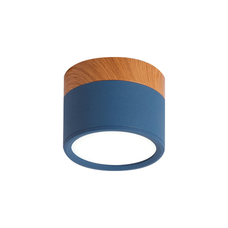 Ceiling light fixture with wooden top and blue base on a white background