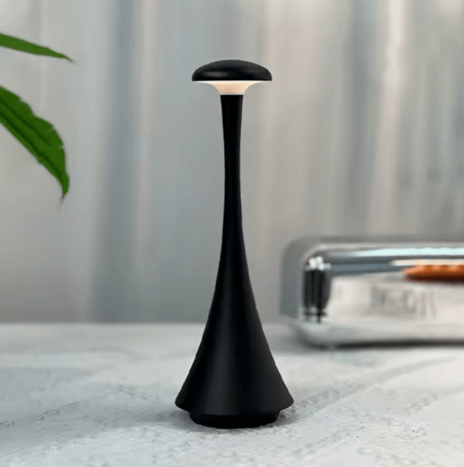Black lamp on a textured surface with a blurred background