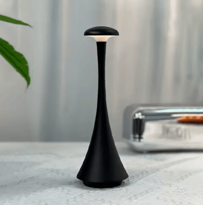 Black lamp on a textured surface with a blurred background