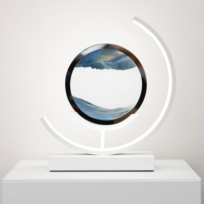 Decorative object with circular design and LED light on a white surface