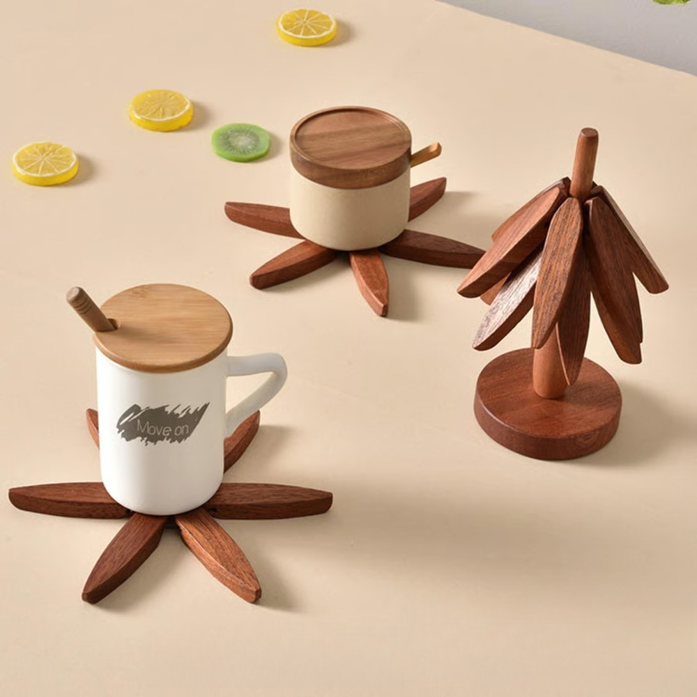Two white mugs with wooden lids and bases on a beige surface with lemon slices.