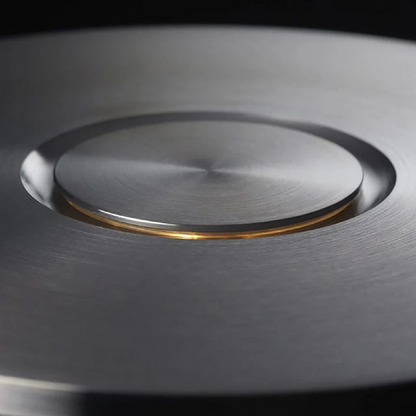 Close-up of a metallic surface with a circular cutout