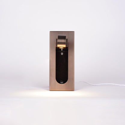Modern wall-mounted light fixture on a white background