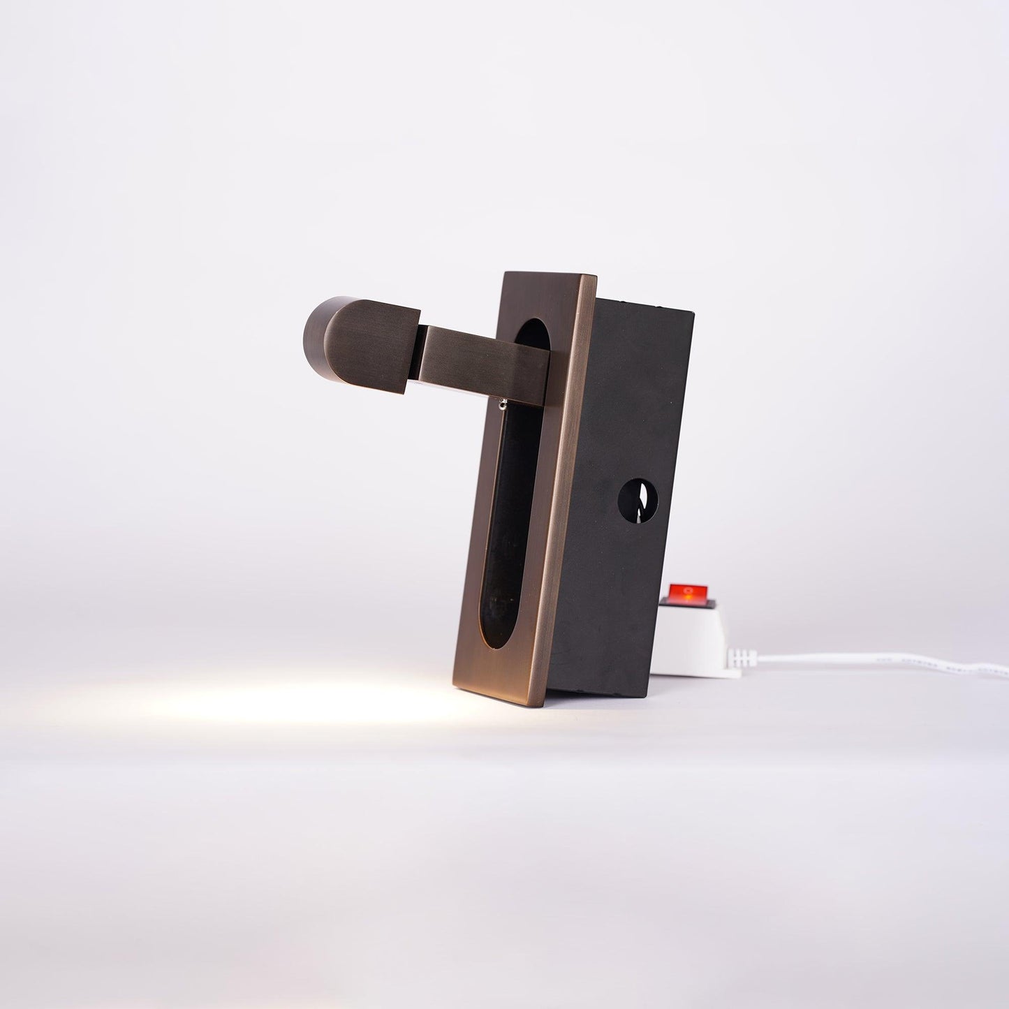 Modern wall-mounted light fixture on a white background