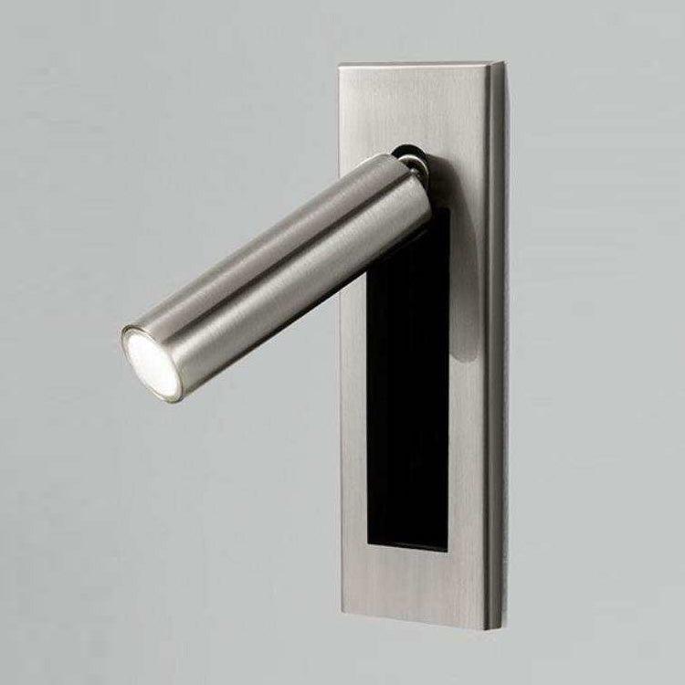 Modern wall-mounted light fixture with a cylindrical design on a gray background
