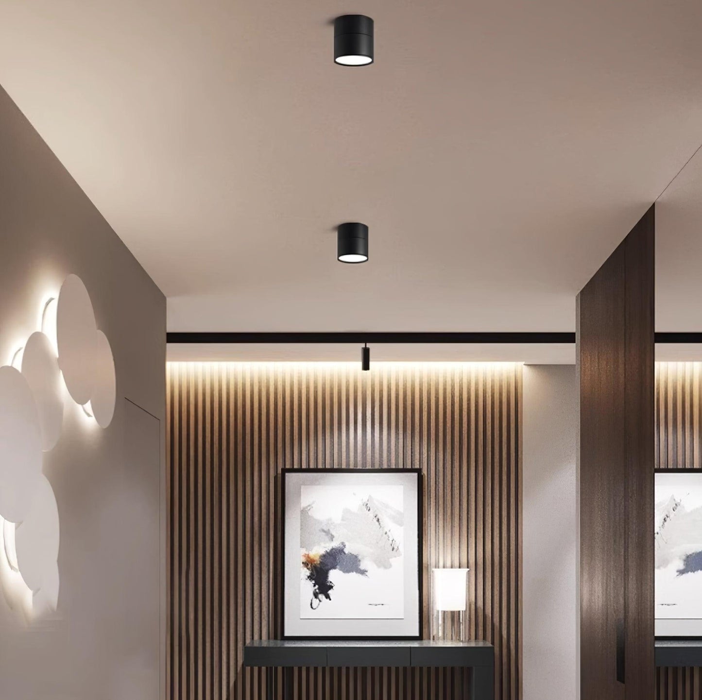 Modern interior design with wall art and lighting fixtures.