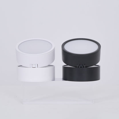 Two cylindrical containers, one white and one black, on a light gray background.