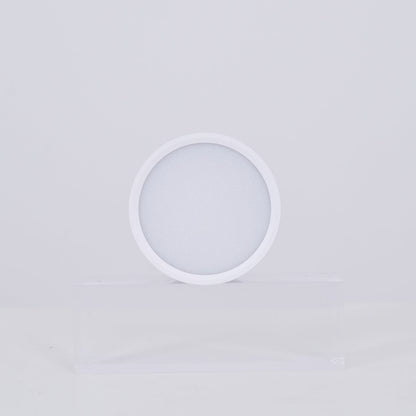 White circular lamp on a light gray background