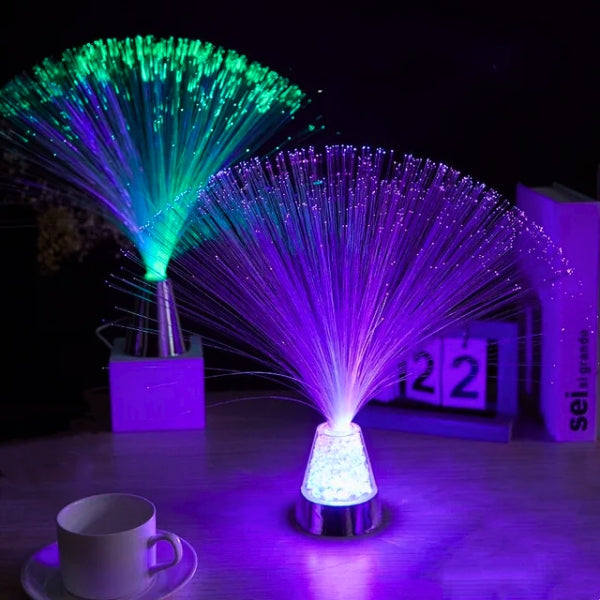 Fiber optic light emitting multicolored light on a dark background