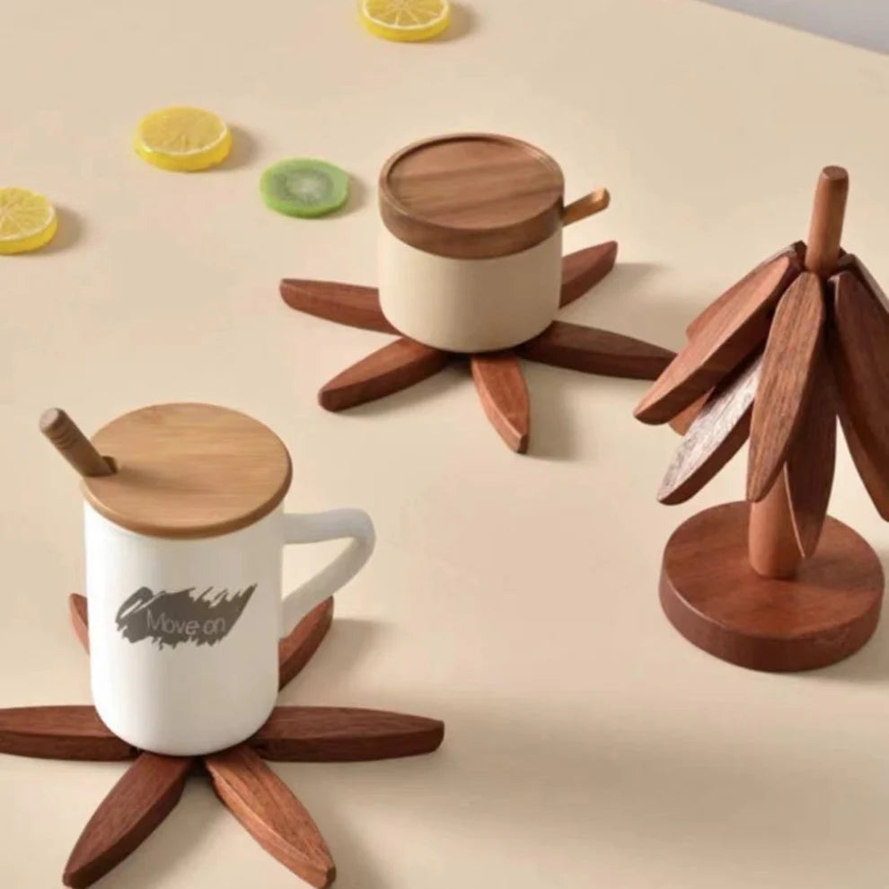 White mugs with wooden lids and coasters on a beige surface with lemon and kiwi slices.