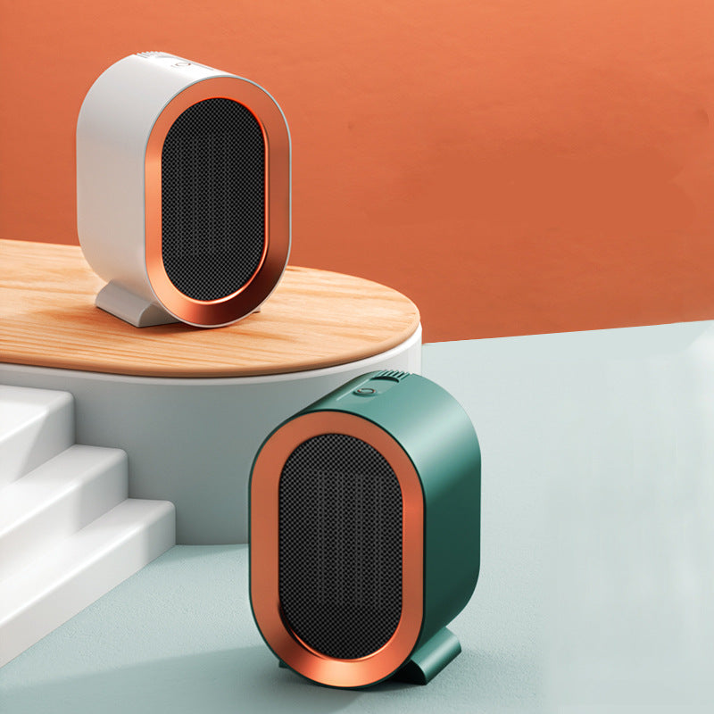 Two small, compact heaters on a minimalistic setup with an orange background