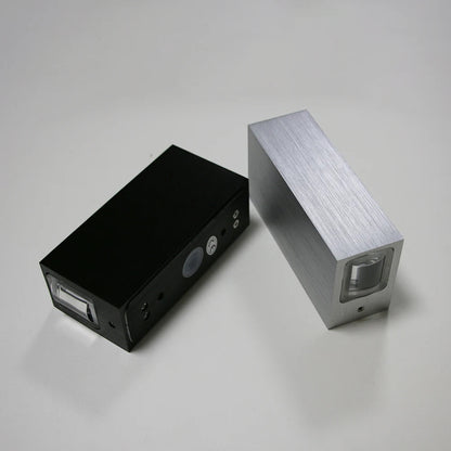 Black and silver electronic devices on a gray background
