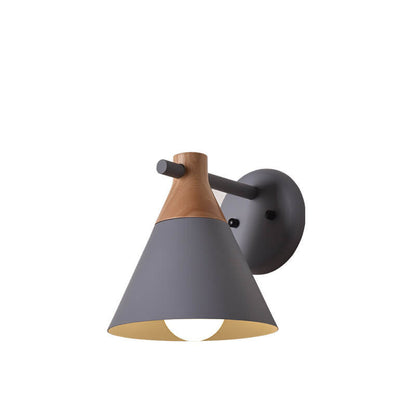 Wall-mounted light fixture with gray shade and wooden top on a white background
