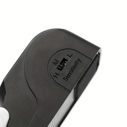 Black electronic device with sensitivity control on a white background
