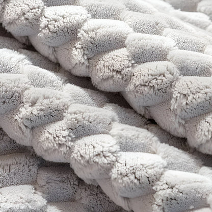 Close-up of textured gray fabric with a braided pattern