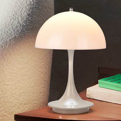 White table lamp on a wooden surface with a dark background