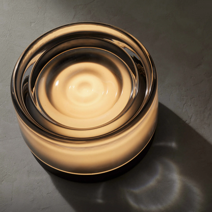 Round wall light fixture on a textured wall
