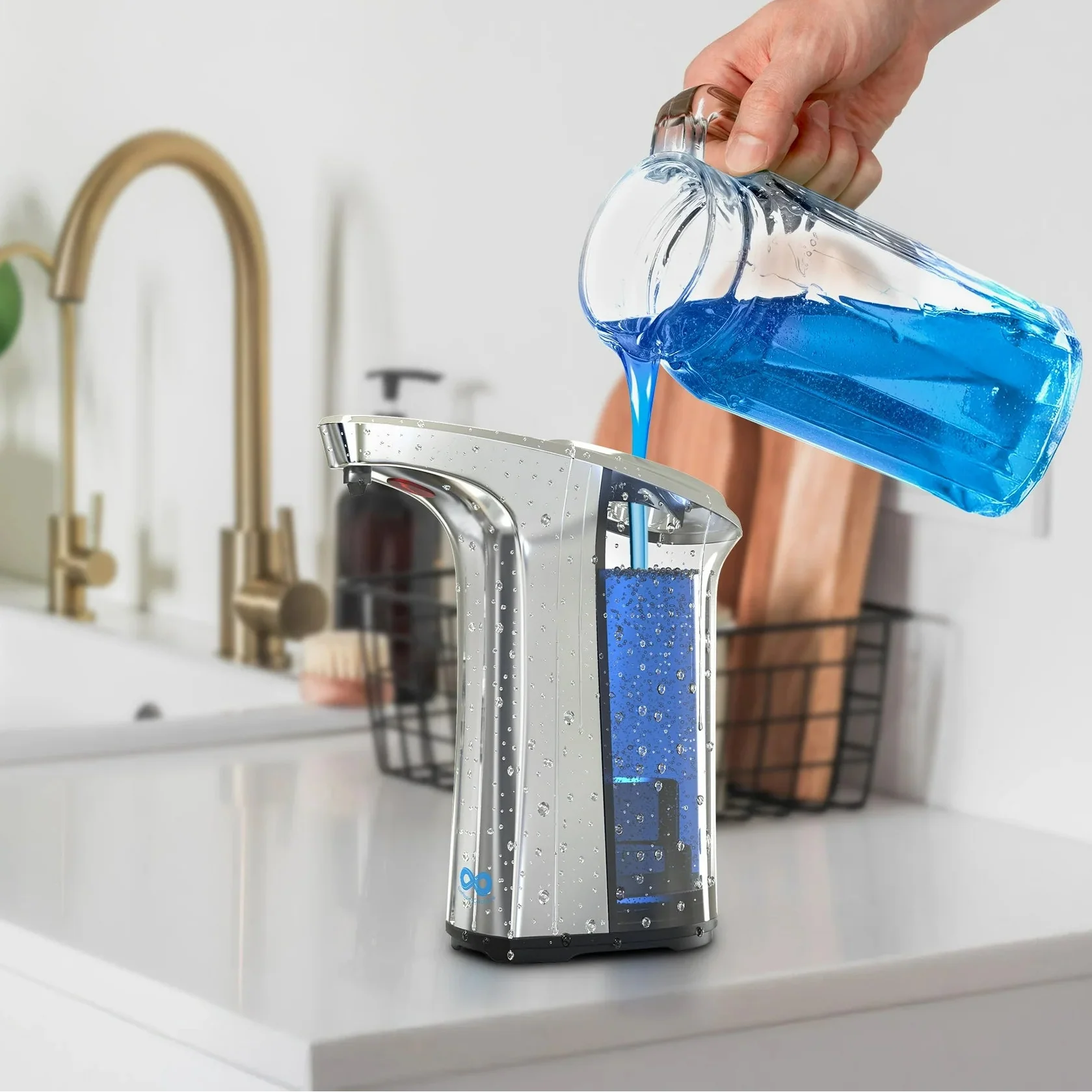 Hand pouring blue liquid from a bottle into a silver soap dispenser with text 'Easy Refill 500ml Capacity' on a kitchen counter.