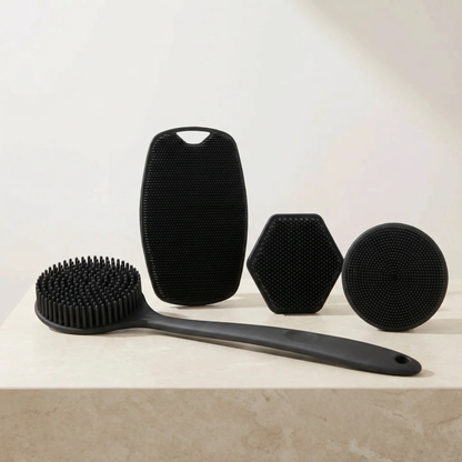 Set of black skin-friendly brushes on a light surface with a neutral background