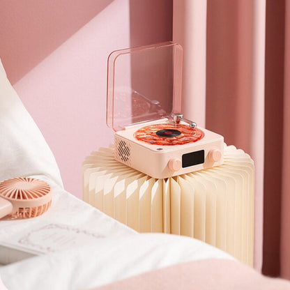 Pink electronic device on a stand with a blurred background