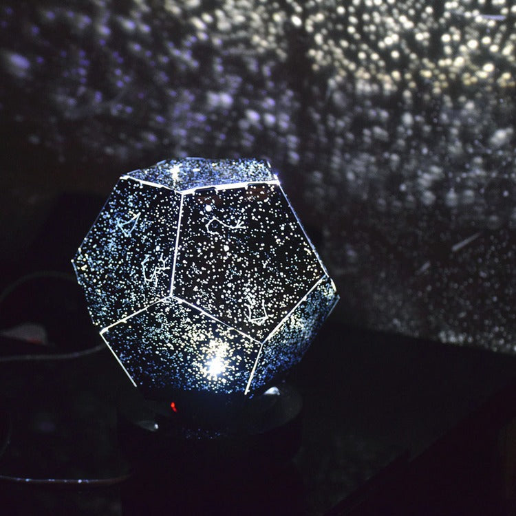 Geometric star projector on a dark background