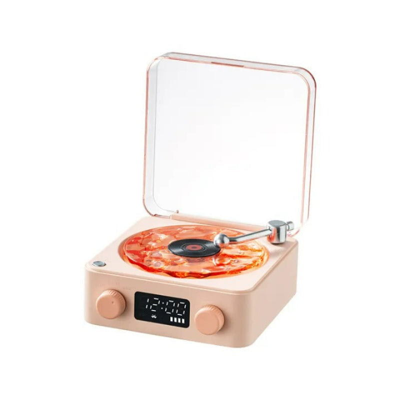 Small record player with a clear lid on a white background
